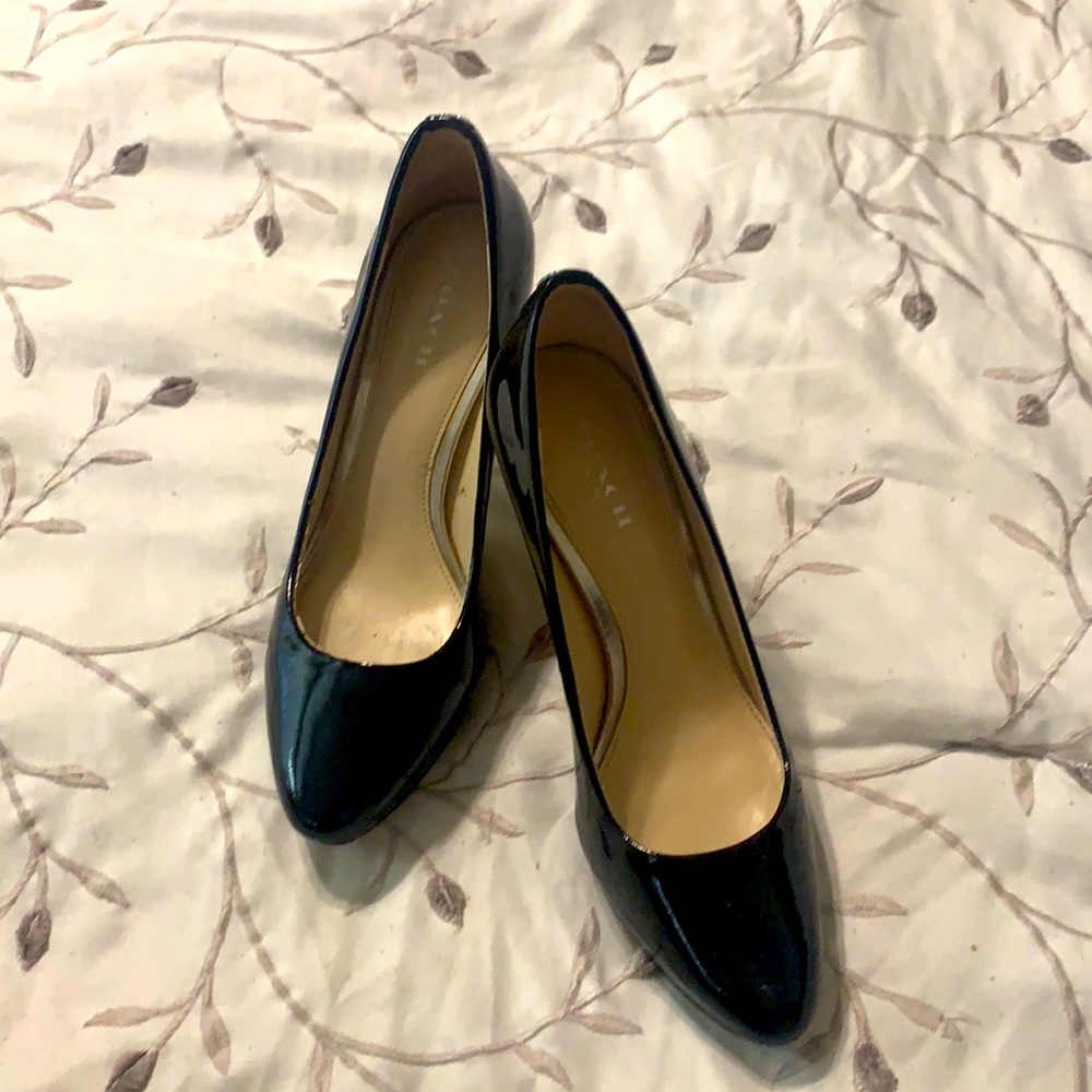 Black COACH patent leather pumps